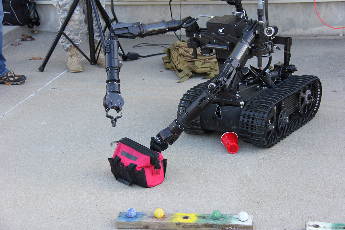 A High Dextrous Manipulation System opens a zippered container as part of the Limited Objective Experiment at Fort Leonard Wood, Missouri. Photo: U.S. Army