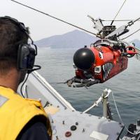 Navy Petty Officer 1st Class Sean McDermott prepares to launch a mine neutralization vehicle. Photo: Petty Officer 2nd Class Jermaine M. Ralliford
