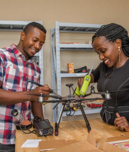 ADDA students Hope Chilunga (left) and Anne Nderitu attach a sensor to a drone. Photo: UNICEF/Moving Minds Multimedia