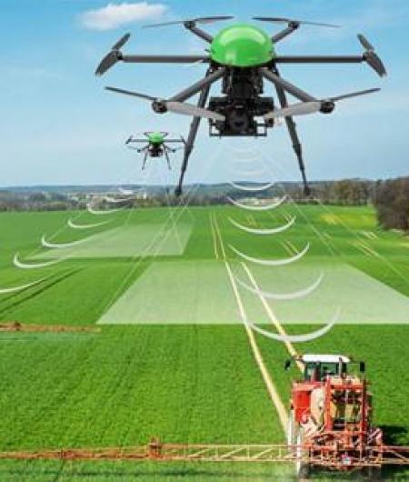 A drone communicates with a ground vehicle on a farm. Image: AgriTech Tomorrow.