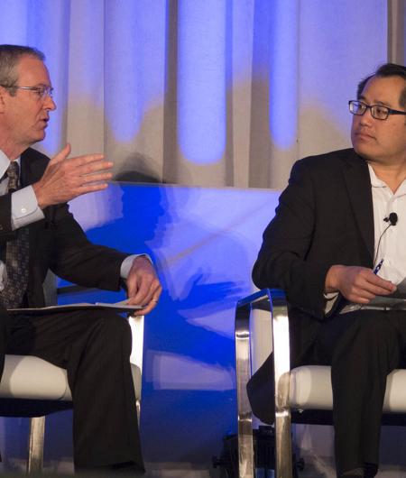 AUVSI's Wynne talks with DOT's Kan at the FAA UAS Symposium. Photo: AUVSI