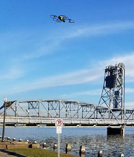 A senseFly Albris drone flies near a bridge it is inspecting. Photo: Collins Engineers