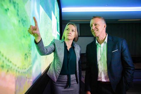 Emily Hughes, chief engineer for Boeing Phantom Works International discussing the AI project with Professor Jason Scholz, Trusted Autonomous Systems Defence Cooperative Research Centre. Photo: Boeing Australia