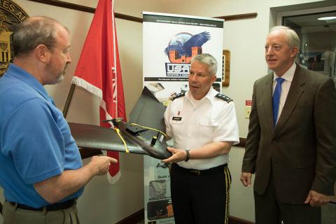 Semonite (left) assesses the features of the MRSD micro-dredge, which provides a rapid deployed, remotely operated dredging capability critical to navigation and port operations during emergency operations. Photo: USACE