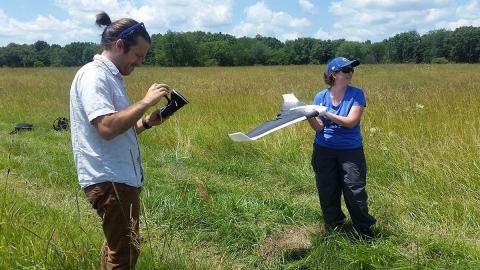 Dr. Holly Jones works with a drone to study a 4,000 acre prairie. Photo: Parrot