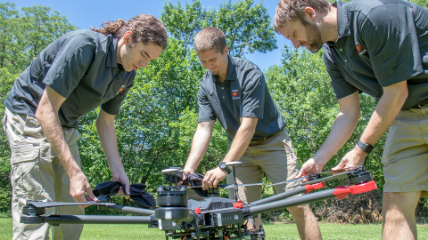 Evan Beachly (from left), Jim Higgins and Carrick Detweiler assemble a drone system before taking it for a test flight. The system features a software application that makes it easy to operate. Photo: Alyssa Amen | NUtech Ventures