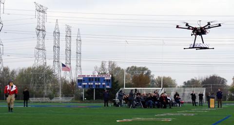 A Lewis University Unmanned Aircraft Systems program drone delivers a college admissions acceptance letter November 13 to eight Romeoville High School. Photo courtesy of Lewis University.