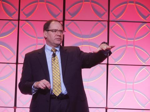 Dr. Paul Rodgers, director of the U.S. Army Tank Automotive Research Development and Engineering Center (TARDEC), speaks at Unmanned Systems Defense. Protection. Security. Photo: AUVSI