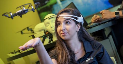 Sarah Garcia, a PhD student in Dr. Marvin Andujar's Neuro-Machine Interaction Lab, controls a drone with her mind. Garcia is wearing an EEG device that detects her brainwaves and signals the drone to move. Photo: University of South Florida