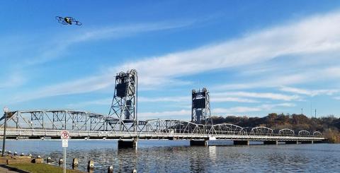 A senseFly Albris drone flies near a bridge it is inspecting. Photo: Collins Engineers